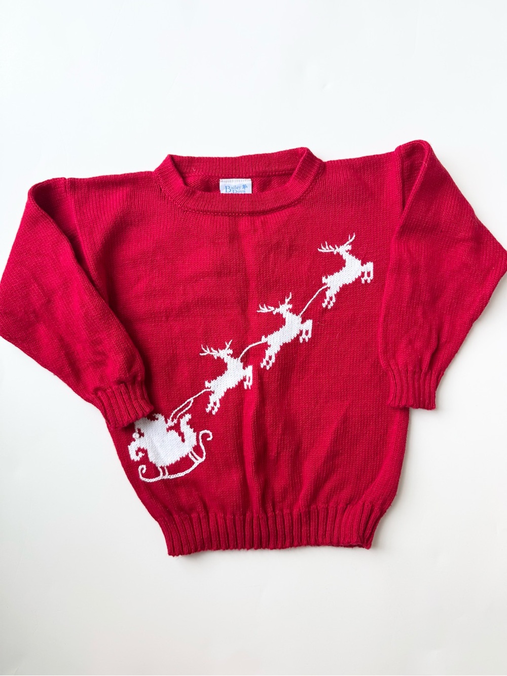 Kids Red Holiday Sweater with White Reindeer Motif